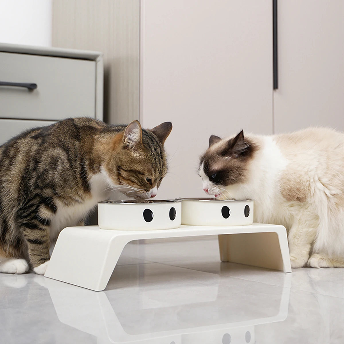 Elevated Kritter Krush pet feeder with stainless steel bowls on a wooden stand for comfortable feeding.