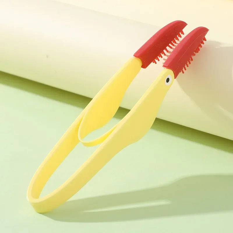 Kritter Krush eye cleaning brush with soft bristles for gentle eye care, shown on a white background.